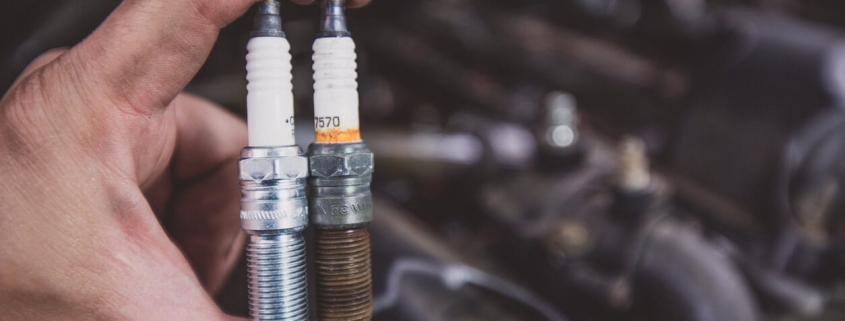new and worn spark plugs